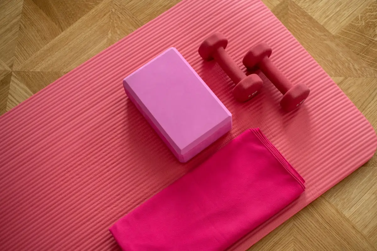A guided breathwork session on a wooden floor with cushions